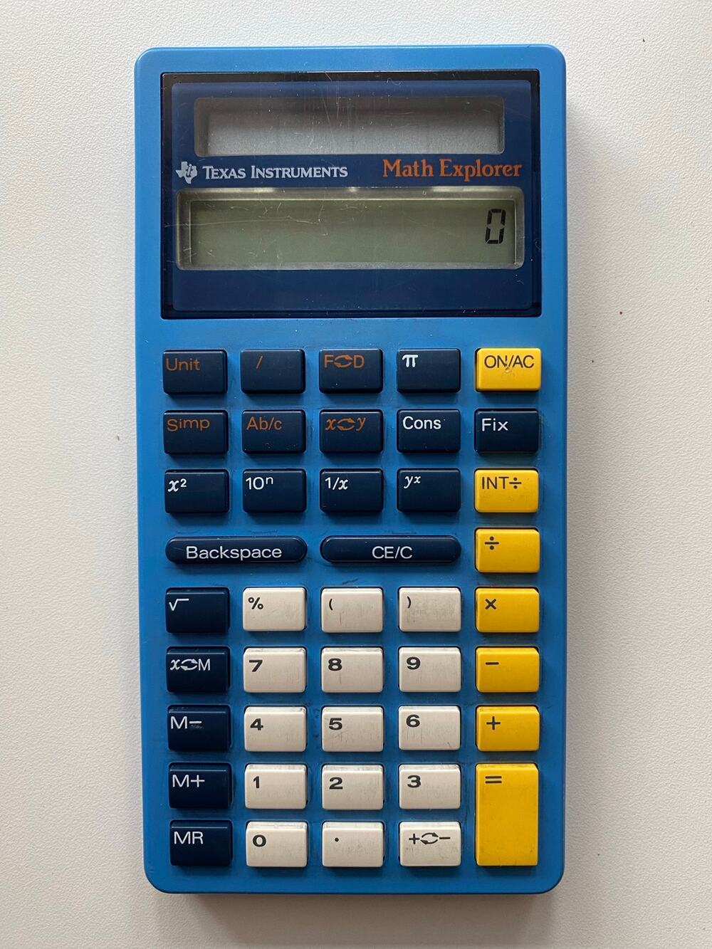Math Explorer Calculator — the vintage blue/yellow educational calculator.